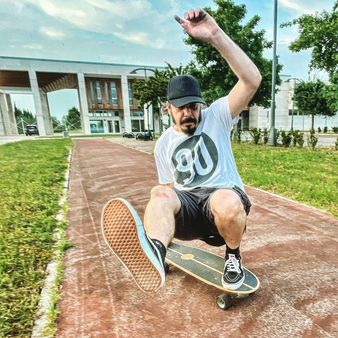 Gianluca Sirri, a member of the '90 The Original' club, skillfully skateboarding, showcasing his dynamic sporting spirit and lifestyle.