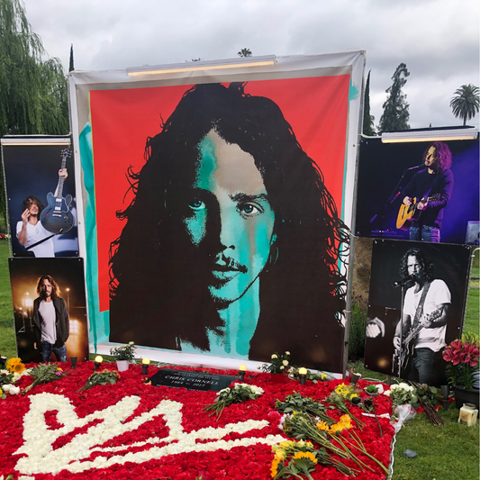 Chris Cornell's memorial at Hollywood Forever Cemetery adorned with flowers and photos