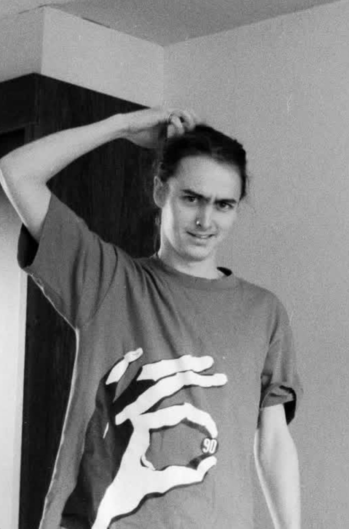 Early-’90s black-and-white photo of Mike McCready wearing the original 90 in Hand tee