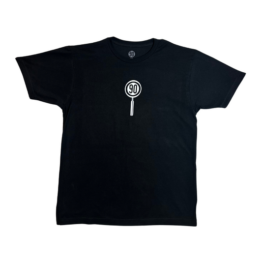 90 logo within magnifying glass on black tee front