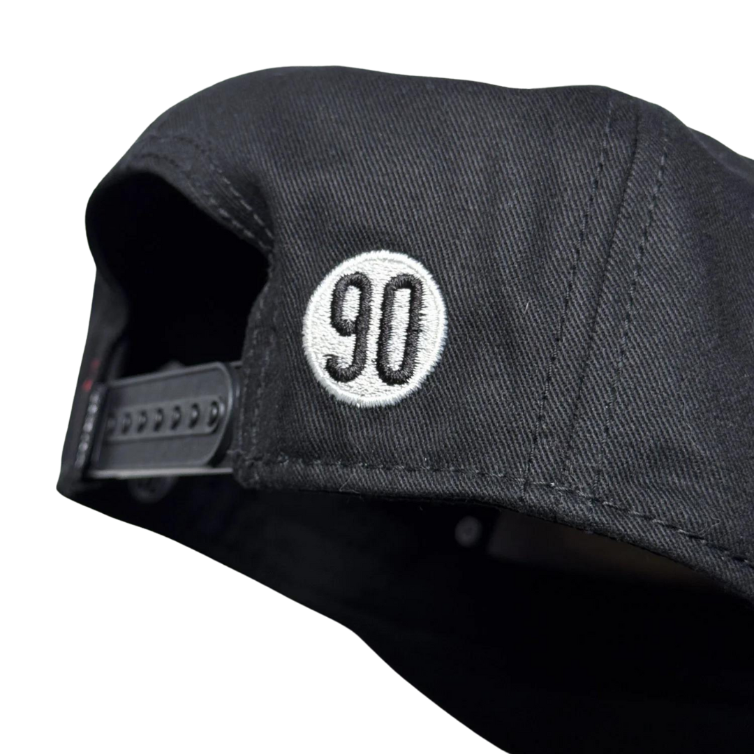 Back view of the 90 The Original Classic Cap with a smaller logo near the strap.