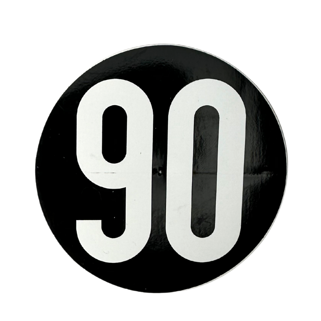 Large 3-inch circular 90 The Original sticker in black.