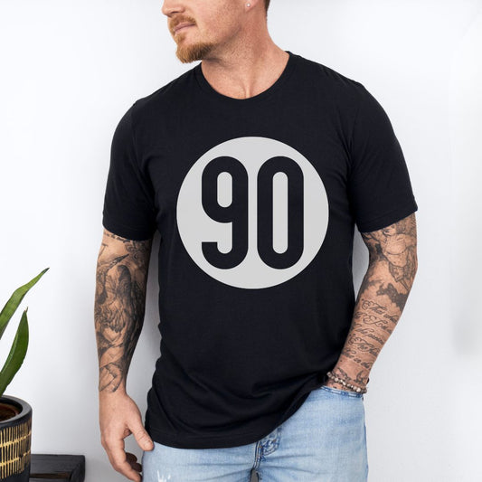 Confident man posing in the 90 The Original black tee, embodying the cool essence of the '90s.